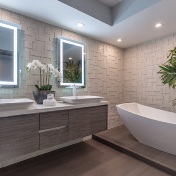 Contemporary bathroom renovation with double vanity and freestanding tub in Boca Raton
