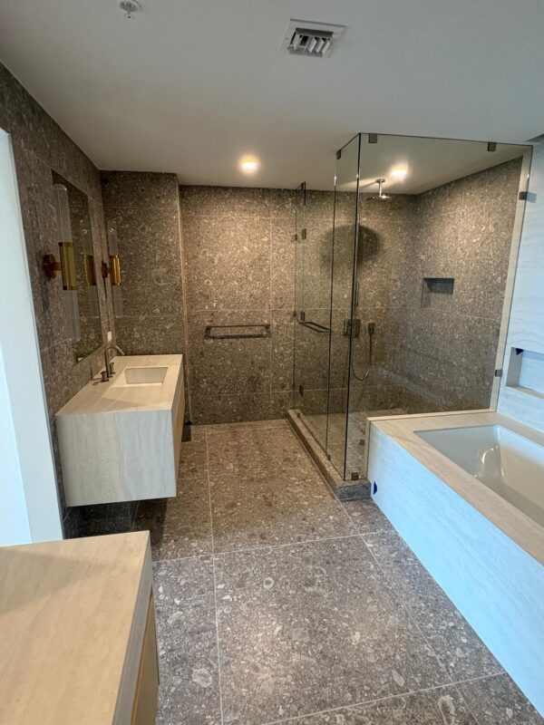 Luxury bathroom remodel in South Florida featuring walk-in shower and glass enclosure